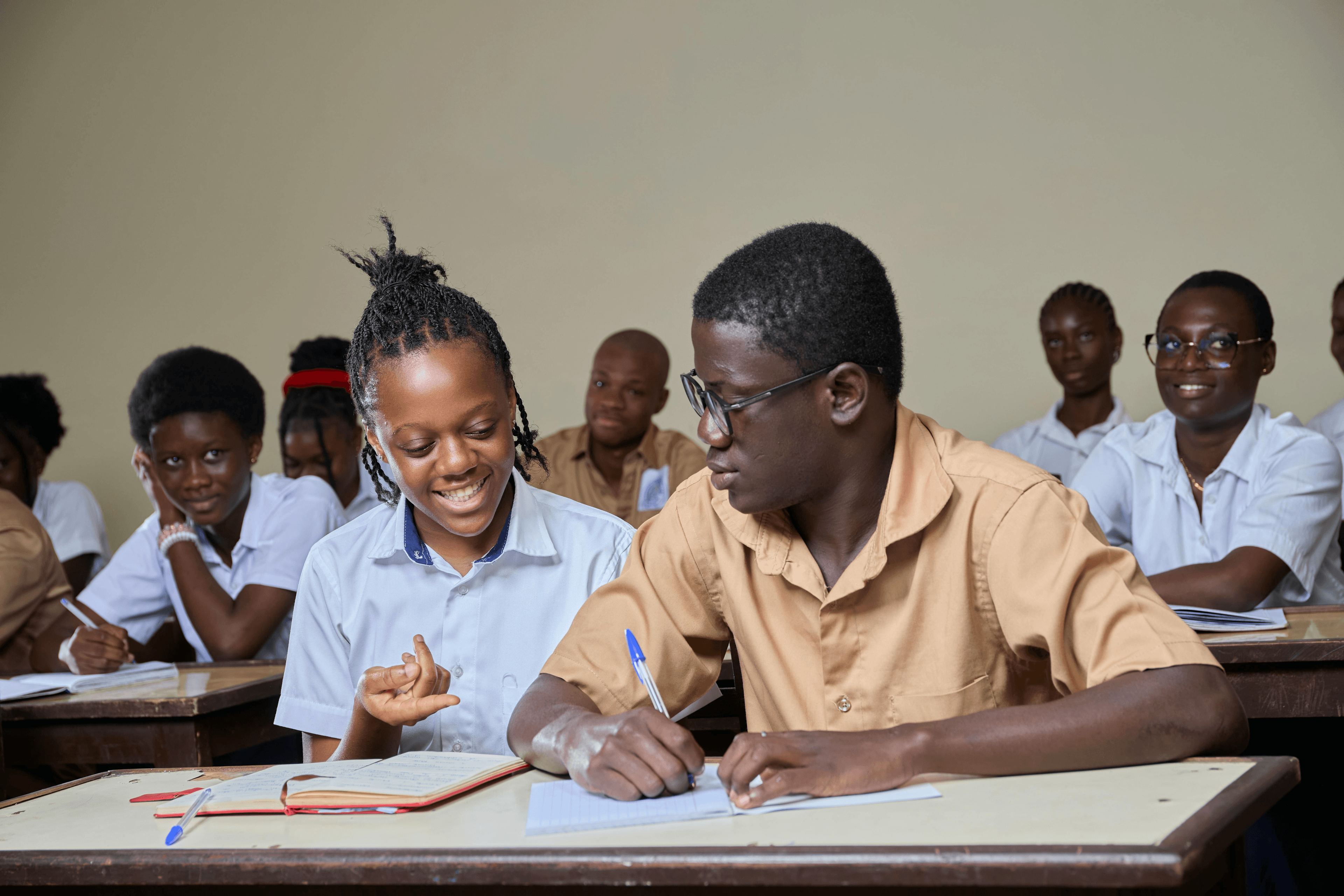 Two matric learners working through a maths problem together